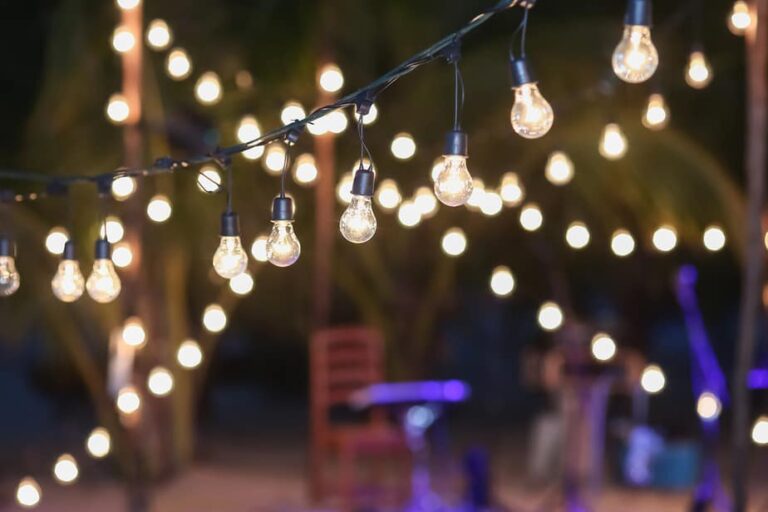 How to Hang String Lights in Your Backyard Without Trees